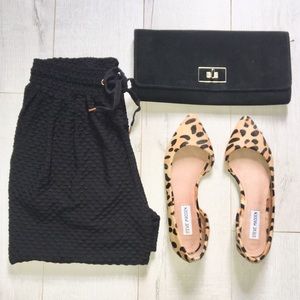 Black textured ankle pants